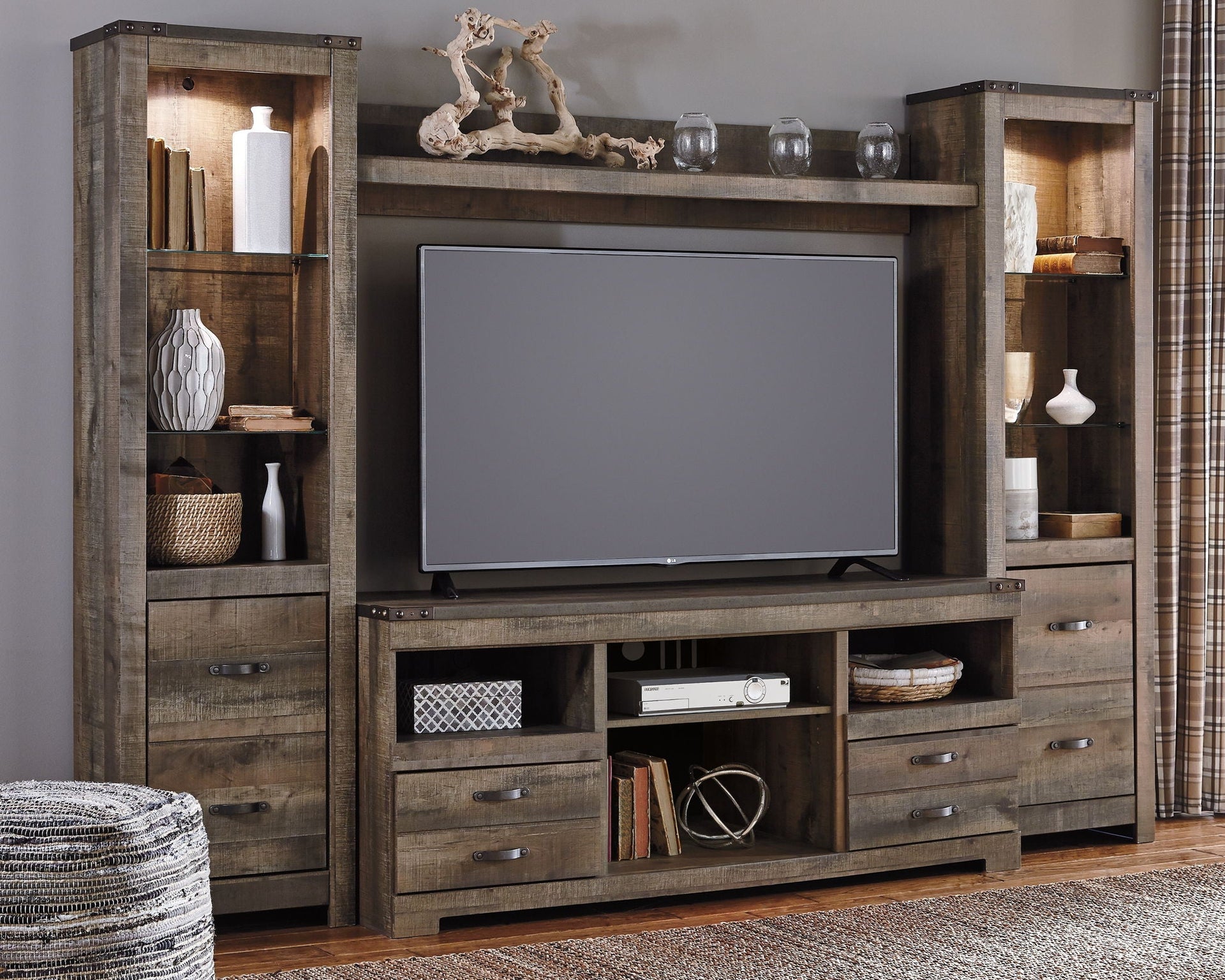 Trinell - 4 Pc. - Entertainment Center - 63" TV Stand - Brown